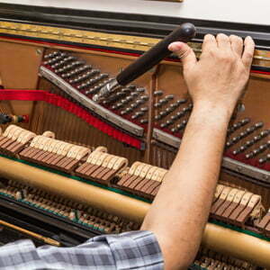male-hand-piano-tuning-300